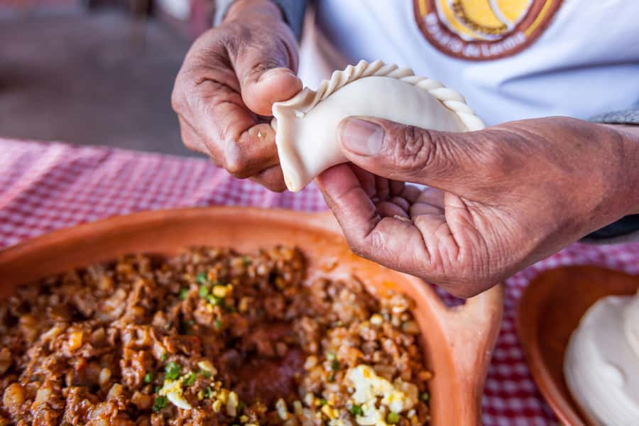 Salta en un Bocado - Cultural Tour & Empanada Tasting - Walking toward the Gaucho Hero