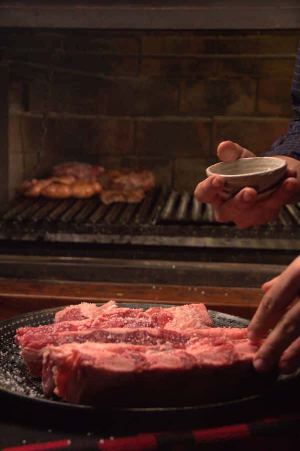 Secrets of Asado in Buenos Asado, BBQ and Dinner - Morcilla, short ribs, and sirloin on the grill